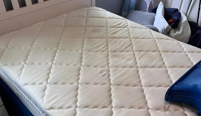 Clean mattress on bed