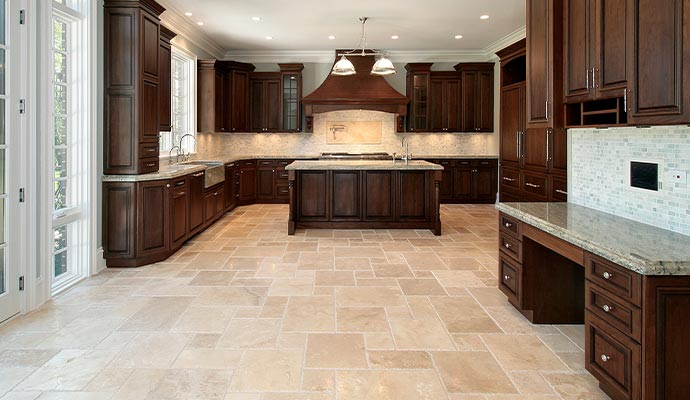 Spacious kitchen limestone floor